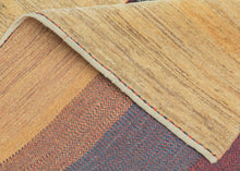 A refined example of modern Gabbeh weaving, this piece offers a minimalist meditation on color and form. Bands of saturated burgundy, indigo, and green move across a central panel, grounded by a glowing yellow field that frames the composition with quiet elegance.

Gabbeh rugs are known for their thick wool, subtle variegation, and expressive use of natural dyes. This example distills those elements into a bold yet harmonious design that is both rooted in tradition and strikingly modern.