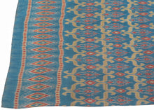 This elegant silk pha sin or traditional tube skirt was handmade in northeast Thailand during the middle of the 20th century.

It is a masterful example of mudmee (ikat) weaving from the Isaan region. The main field (phuen sinh) showcases a staggered arrangement of stylized vegetal or flame motifs in golden ochre and brick red, which is an elegant reinterpretation of classic Lao-Tai design language passed down through generations of Isaan weavers.

The upper band (hua sinh) is particularly dynamic with a ro