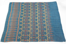 This elegant silk pha sin or traditional tube skirt was handmade in northeast Thailand during the middle of the 20th century.

It is a masterful example of mudmee (ikat) weaving from the Isaan region. The main field (phuen sinh) showcases a staggered arrangement of stylized vegetal or flame motifs in golden ochre and brick red, which is an elegant reinterpretation of classic Lao-Tai design language passed down through generations of Isaan weavers.

The upper band (hua sinh) is particularly dynamic with a ro