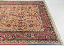 yellow heriz It features a symmetrical all over garden lattice that is densely populated with stylizes floral rosettes, palmettes, and leafy vines in soft coral, midnight blue, ivory and pistachio on a rare golden yellow ground.&nbsp; The red ground main border is composed of blossoming&nbsp;palmettes and crisply rendered saz leaves. A soft-spoken palette that is well-balanced plays off of contrast. Densely woven of high-quality wool making a hard-wearing new production piece that properly honors