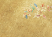 This elegant Deco rug features a refined open-field design with delicate floral sprays accenting a uncommon gold field. The softly rendered peonies, lotus blossoms, and leafy tendrils in pastel shades of pink. blue, and green create a graceful. understated compostion. features peonies, chrysanthemums, fruit blossoms among flowers rendered in greens, yellows, blues in purples. The flowers really pop on bright red, which is a shade most commonly associated with luck, joy, and prosperity in China.