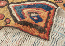 This vibrant Gabbeh was woven by the Qashqai during the 2nd quarter of the 20th century

The design centers on bold concentric diamond medallions floating on a warm saffron field. The medallions are flanked by playful flowering shrubs and framed by a charming rosette border. The palette is exceptional: saturated indigo, terracotta, sky blue, and emerald green, all rendered in luminous natural dyes.