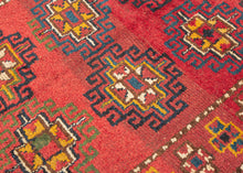 This Kurdish Yatak was handwoven in Eastern Anatolia during the late 19th century.

A vibrant and expressive Kurdish Anatolian Yatak, woven in the highland villages of Eastern Anatolia and originally intended as a sleeping or bedding rug. The format is classic with a warm, saturated red field filled with a rhythmic repeat of memling guls outlined in deep indigo and enlivened with saffron, ivory, moss green, and brick tones. The drawing is bold and spontaneous, full of angular hooked outlines and charming tr
