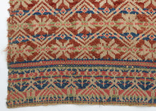 This elongated brocaded panel reflects the celebrated weaving traditions of Samugheo, the Sardinian village renowned for its mastery of pibiones “grain” weave and richly patterned household textiles. The central field displays repeated diamonds enclosing stylized stars, while the end skirts feature rare anthropomorphic figures that read either as a man and woman in union or dancers repeated in procession-like rhythm. Their presence evokes fertility, marriage, and communal celebration, suggesting the textile