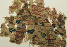 A wonderfully animated fragment of late antique Egyptian tapestry weaving, densely worked with stylized&nbsp;zoomorphic and vegetal forms with&nbsp;&nbsp;small geometric compartments in muted red, blue-green, rose, ochre, brown, and black.

The imagery is compressed into horizontal registers, with individual motifs appearing almost like tiny pictograms. Its fragmentary survival only heightens that quality, turning what was once part of a larger textile into an unexpectedly modern, almost collage-like compos