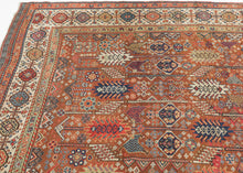 This exceptional late 19th-century Shekarlu rug is a superb example of the bold, highly expressive weaving tradition of the Qashqai Confederacy. Its rich terracotta field is animated by an elegant arrangement of towering cypress and tree-of-life motifs, interspersed with a lively assortment of tribal devices, rosettes, birds, combs, and other protective talismanic symbols that reward close inspection.