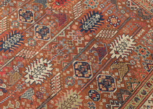 This exceptional late 19th-century Shekarlu rug is a superb example of the bold, highly expressive weaving tradition of the Qashqai Confederacy. Its rich terracotta field is animated by an elegant arrangement of towering cypress and tree-of-life motifs, interspersed with a lively assortment of tribal devices, rosettes, birds, combs, and other protective talismanic symbols that reward close inspection.