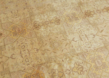 An elegant mid-20th-century Tabriz carpet distinguished by its intricate allover design and softly washed palette.

The field is organized as a continuous lattice of interlocking angular compartments, alternating with floral medallions, palmettes and smaller geometric devices. The tightly fitted shapes create an almost tessellated rhythm across the surface, balancing strong architectural structure with delicate vegetal drawing.