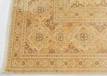 An elegant mid-20th-century Tabriz carpet distinguished by its intricate allover design and softly washed palette.

The field is organized as a continuous lattice of interlocking angular compartments, alternating with floral medallions, palmettes and smaller geometric devices. The tightly fitted shapes create an almost tessellated rhythm across the surface, balancing strong architectural structure with delicate vegetal drawing.