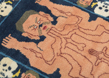 Tantric meditation mat in Tibet.  It features a man's body which is flayed open with various lines representing different layers of the internal nervous system. It is an expression of the Buddhist pursuit of bodily detachment. Practitioners of Tibetan Vajrayana Buddhism in pursuit of spiritual enlightenment, used in meditation or as a seat of power or authority by advanced practitioners of esoteric Buddhism. The outer border alternates between a head and skull representing the transitoriness of life. 