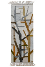Rolakan midcentury Swedish It features an abstract design woven with an organic feel. The design is reminiscent of bare branches reaching toward the sky. The straightforward palette of light and dark browns, light and dark blues, gray and white and perfectly balanced with use marled yarn. The initials "IS" for textile artist Ingrid Solow can be found in the bottom right corner.