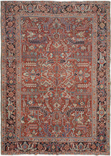 This Heriz rug was handwoven in Northwest Iran during the second quarter of the 20th century.  It features an allover design of geometric palmettes and large serrated leaves in blues, green, coral, gold, black and ivory on an undulating brick ground. All over designs are less common on Heriz rugs which most often feature large central medallions. The main border is composed of a rosette and outstretched arm palmette border on a surmah ground.