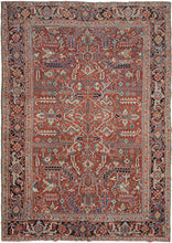 This Heriz rug was handwoven in Northwest Iran during the second quarter of the 20th century.  It features an allover design of geometric palmettes and large serrated leaves in blues, green, coral, gold, black and ivory on an undulating brick ground. All over designs are less common on Heriz rugs which most often feature large central medallions. The main border is composed of a rosette and outstretched arm palmette border on a surmah ground.