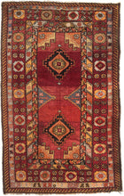 This Turkish rug is woven in western Anatolia during the second quarter of the 20th Century.  This rug features two stepped diamond devices atop vast rasberry red ground with various half and quarter medallions along the perimeter in purple, orange and yellow. Framed by a main border that alternates between large palmettes and bouquets of smaller 8 pointed rosettes and various minor borders including diagonal stripes, tulips and interlocking combs.