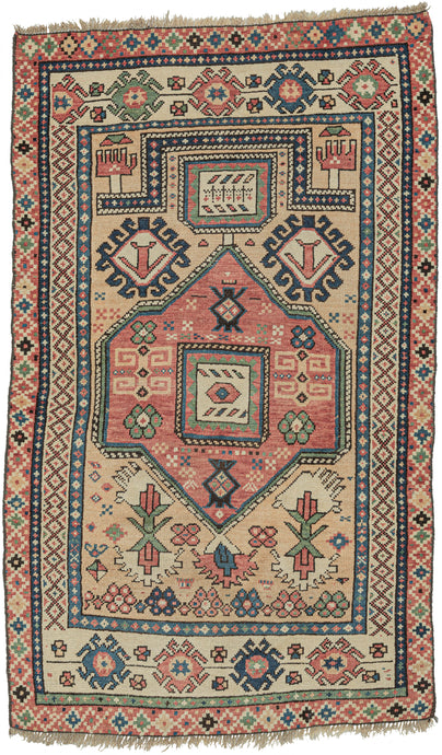 Classical prayer rug format hybridized with other Caucasian elements and weaving style. 