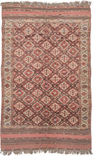This Anitque Yomud Turkmen Rug features an allover design of red and white "Chodor" guls in lattice formation on an aubergine ground. The field is framed by pinwheel palmettes and meandering vines on a bright ivory ground. The main border is drawn in thick ivory cursive against big blocks of green, orange, and aubergine.