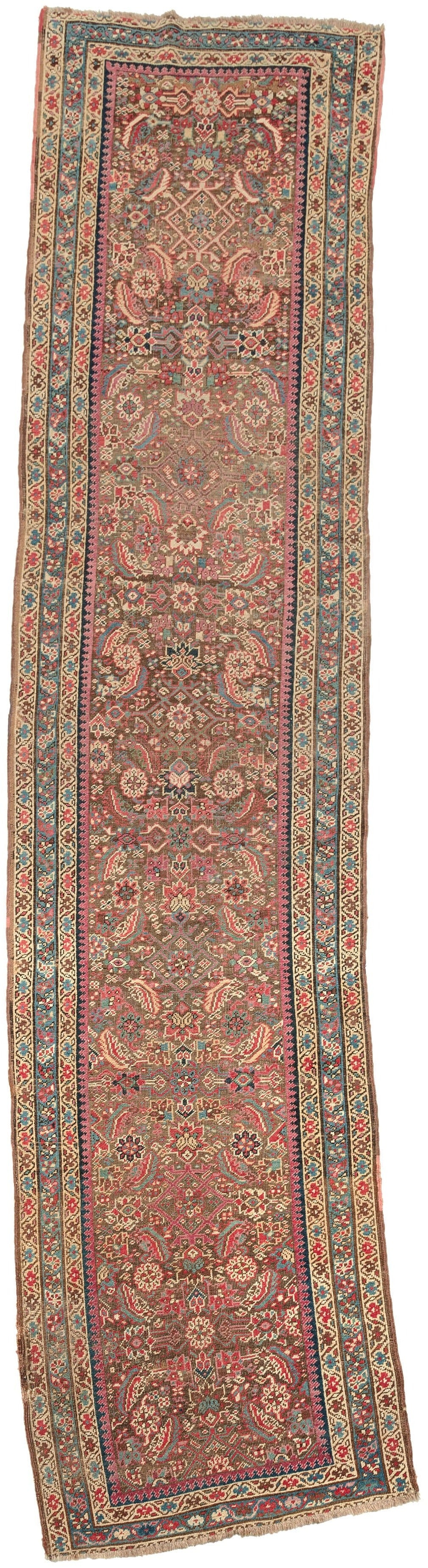 This Karabagh runner was woven in the south Caucasus by Armenians during the late 19th century.  It features an all over herati design pattern in blues, greens, reds, pinks, yellow and ivory on a chocolate ground. The ground has oxidized adding dimensionality to the piece. Framed by a inner laleh abbasi border and three outer borders of scrolling rosettes on exceptional blue and yellow grounds.
