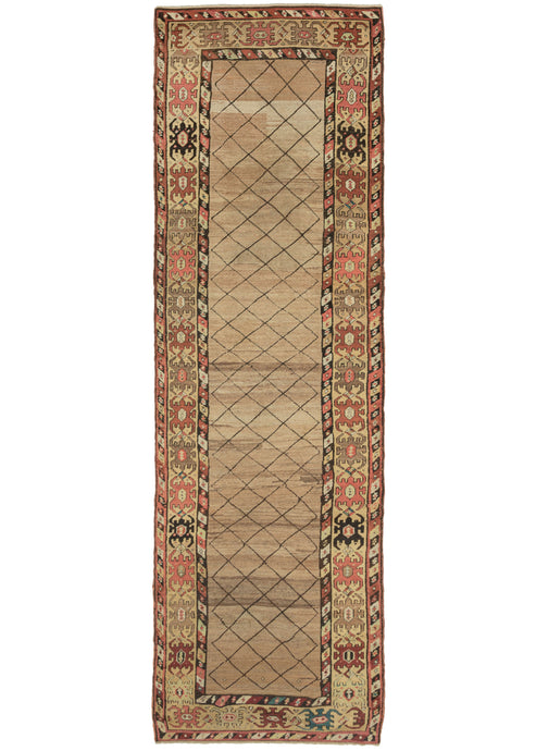 This Camel Hair Bidjar Runner features a simple yet stunning thin diamond lattice on a camel ground. The lattice pattern utilized a brown that has oxidized giving the rug an unintended but wonderful dimensionality as if it was etched in. The ground is woven of various lots of undyed camel wool fields which undulates organically and is quite calming. The main border features pelt-like devices in various browns, reds, green,s and blue flanked by diagonal striped minor borders filled with an 