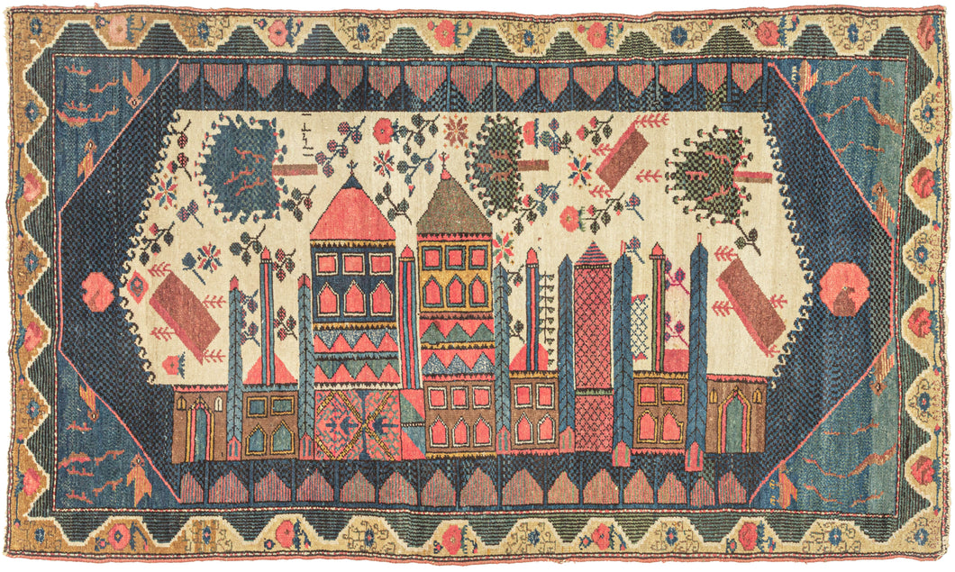 Antique cityscape Malayer small runner featuring a wild cityscape in blues, green, yellow, gold, ivory, and faded pinkish-red. Tall polychrome buildings with wonky windows and doors are full of personality while various trees and flowers float above the city in a psychedelic manner almost as if they were caught in a tornado or lifted off the ground by a gravitational force.