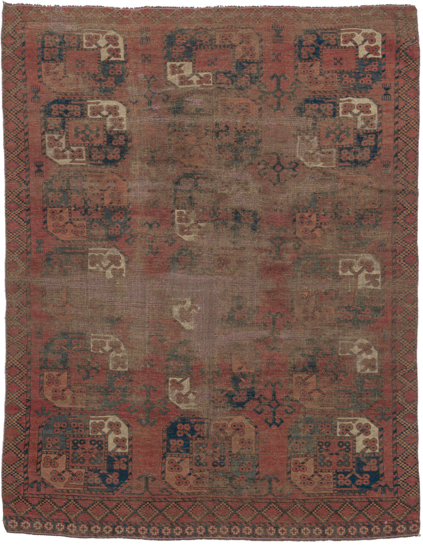 SILK KINTSUGI A soulful early Ersari Turkmen rug, measuring with a beautifully aged surface and a striking contemporary repair. The field is arranged with large-scale Turkmen guls in a soft, time-muted palette of deep red, brown, indigo, charcoal, and ivory. Years of wear have softened the design, giving the rug a quiet, atmospheric quality while still preserving the rhythm and strength of its original tribal composition.