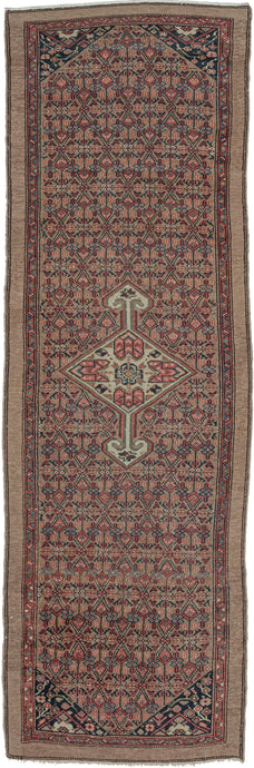 Camel Serab runner features a small central medallion on an all-over ground of diamond latticework in red, orange, and classic undyed camel.  Nicely finished with a simple meander inner border and an outer border composed of a simple yet powerful band of undyed camel. A great little runner with a lot of personality and in a hard-to-find size.