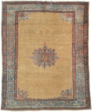 This Sultanabad was handwoven in Western Iran during the early 20th century.   It features a central medallion that floats on an open and expansive golden camel ground. The field is bare other than the medallion and four cornices each mimicking a mirorred quadrant of the medallion. Framed by a main border of scrolling vegetation in pink, green, ivory and gold on an icy blue ground.  Well-balanced with a desirable palette in a hard to come by size.