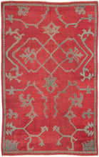 This Oushak was handwoven during the 19th century in Western Anatolia.  This elegant rug features a simple yet dramatic asymmetric design of curling vines, palmettes and abstracted fantastic creatures. A well spaced large scale field patter with a limited palette of a rich royal red and two tones soft blue framed by a thin border.