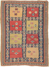 Antique Qashqa'i kilim featuring a simplified garden design comprised of a grid of squares in big blocks of patinated greens, reds, and yellows. Each block contains various protection symbols. The composition is framed by an electric Laleh abbasi border with zig-zag edges. The open space of the squares plays well off the tight patterning of the grid and borders and accentuates the expressive nature of the weaving.  