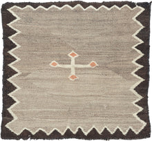 Antique Navajo gray small kilim composed of single slight off-centered ivory cross with orange nodes on a heathered gray field. Framed by thin ivory zigzag and solid brown perimeter.