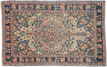 A finely woven small Tabriz rug with a compact medallion composition set against a softly toned field. The drawing is crisp and balanced, with scrolling floral motifs and subtle geometric accents that feel refined rather than busy at this intimate scale.