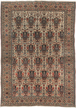 This Farahan rug was woven in Western Iran during the second quarter of the 20th century.  It features an allover "Zili Sultan" design on a rare ivory ground.  The Zili Sultan desgin refers to an allover design of flower-filled vases sometimes also incorporating birds as is the case here. With a main border The main border of concentric latch hook motifs framed by wonderful minor borders of budding roses.