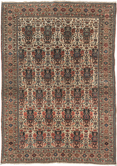 This Farahan rug was woven in Western Iran during the second quarter of the 20th century.  It features an allover 