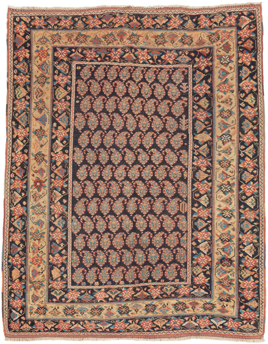 A beautifully composed Afshar rug featuring a classic allover boteh field, each sprouting motif rendered with crisp definition against a deep indigo (almost black) ground. The botehs are arranged in tightly organized rows, creating a shimmering, textile-within-textile effect that rewards close looking. Subtle shifts in dye tone animate the surface, giving the field a sense of depth and movement.

Framing the boteh lattice is a vibrant, floral border system of spiraling blossoms, stylized palmettes, and angu