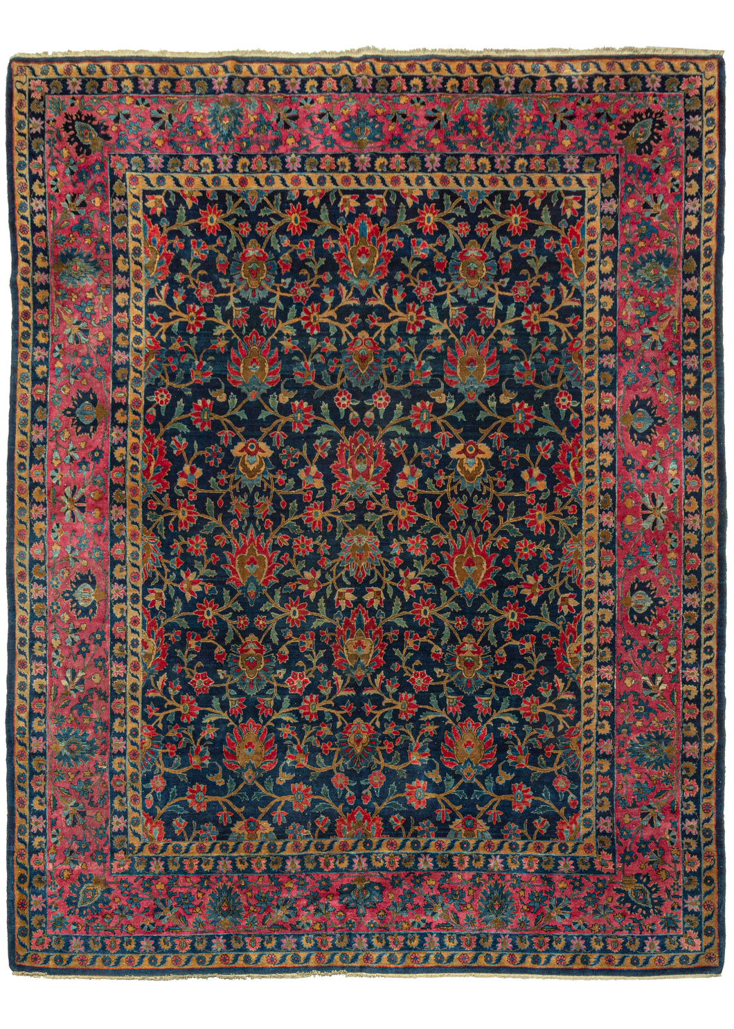 This Luxurious Manchester Keshan Rug features a curvilinear floral motif in rich reds with soft brown branches and lively green leaves on an inky blue ground. It is framed by a perfectly reconciled palmette border with a variety of wonderful blues on a soft pink ground. The composition has been finely executed with silky 