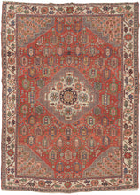 This Rare & Unusual Heriz features a stepped central medallion with a large central rosette surrounded by smaller rosettes atop a rich red ground of large botehs. Hatchmarks around the medallion as well as the stepped cornices give the piece a dynamic energy.  Each cornice features a field of rosettes on a coral ground. The main border is composed of a crisply drawn rosette meander on a bright ivory ground. Many of the classic Heriz hallmarks are in rare patterns and sizes.