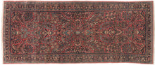 This rug showcases a classic curvilinear floral design on a deep red field beautifully detailed with scrolling vines, palmettes, and blossoming sprays. This classically patterned rug is perfect for high traffic areas and should last for generations to come. It's rare short runner size makes it perfect for an entryway, kitchen or as a statement piece in a more intimate space.