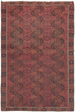 This Ersari Turkmen rug was woven during the first quarter of the 20th century in Northern Afghanistan.  It features a traditional Ersari gül design with a soft palette of orange and indigo on an earthy madder red ground with accents of natural undyed brown and ivory wool. The more skeletal secondary güls are nice complement to the fuller main guls and give the field a more open feel.