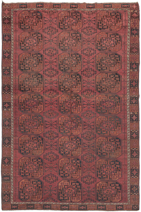 This Ersari Turkmen rug was woven during the first quarter of the 20th century in Northern Afghanistan.  It features a traditional Ersari gül design with a soft palette of orange and indigo on an earthy madder red ground with accents of natural undyed brown and ivory wool. The more skeletal secondary güls are nice complement to the fuller main guls and give the field a more open feel.