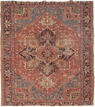 This Antique Heriz Rug features a geometric central medallion and rich saturated tones. A red field is complemented by deep navy, various blues and greens as well yellow, coral adn ivory. Wonderful tones throughout but the icy blue, indigo, chartreuse and jade really sparkle. It is framed by a navy main border of polychrome palmettes. In a desirable size that is more squarish than usual.