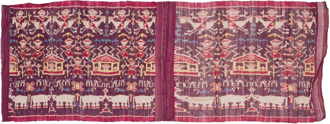 A striking Cambodian&nbsp;hol textile woven in the weft ikat technique, dating to the 1980s revival period. Against a rich plum and magenta ground, the composition features mirrored rows of apsara or court-dancer figures, stylized Angkorian temple forms, floral motifs, and bands of Khmer script identified as reading “Kampuchea.”

The imagery draws on Cambodia’s deeply rooted Angkorian visual language, translating forms associated with temple architecture and celestial dancers into silk. Rather than depictin
