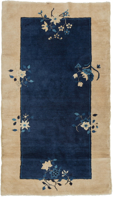 This Blue Chinese Deco Rug features an open blue field framed by a wide cream border. Two thin lines in navy and indigo separate the two color blocks and are straddled by various floral bouquets that provide the only decoration. Simple and straightforward with a luxurious feel.