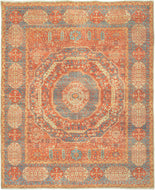 This Mamluk design rug was woven in India during the 21st century.  It features the distinctive patterning and color palette of classical Mamluk rugs. Mamluk rugs are a type of rug that was woven in Egypt during the 15th and 16th centuries. The graphic central medallion is formed of concentric shapes that gives the rendering a kaleidoscopic feel. Soft but lively tones of reds, blues, golds and greens are both striking and harmonious.