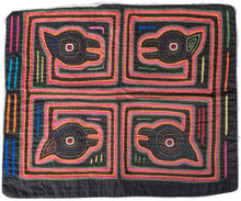 Vintage Mola cloth handmade by the Guna (previously spelled Kuna) people of Panama.  Mola is a reverse appliqué technique, similar to the technique used in quilting but using multiple layers of different-colored cloth that are first sewn together before a design is creating by cutting away different layers. 