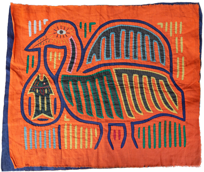Vintage Mola cloth handmade by the Guna (previously spelled Kuna) people of Panama.  Mola is a reverse appliqué technique, similar to the technique used in quilting but using multiple layers of different-colored cloth that are first sewn together before a design is creating by cutting away different layers. This Mola features a wonderfully abstracted bird carrying a fish against.  Great use of red, yellow, green, pink, turquoise, blue and black against a vibrant orange backdrop. 