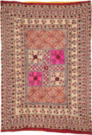 rajasthan It features various naturalistic floral motifs and squares that are made with hand drawn mordant and resist dyed cotton. In various reds and purples with sage, dutch orange and most notably a neon pink. These pieces are referred to as Jajam and often made as part of a dowry. They are used for honored guests or communally as a seat for village council members when making social and judicial decisions.