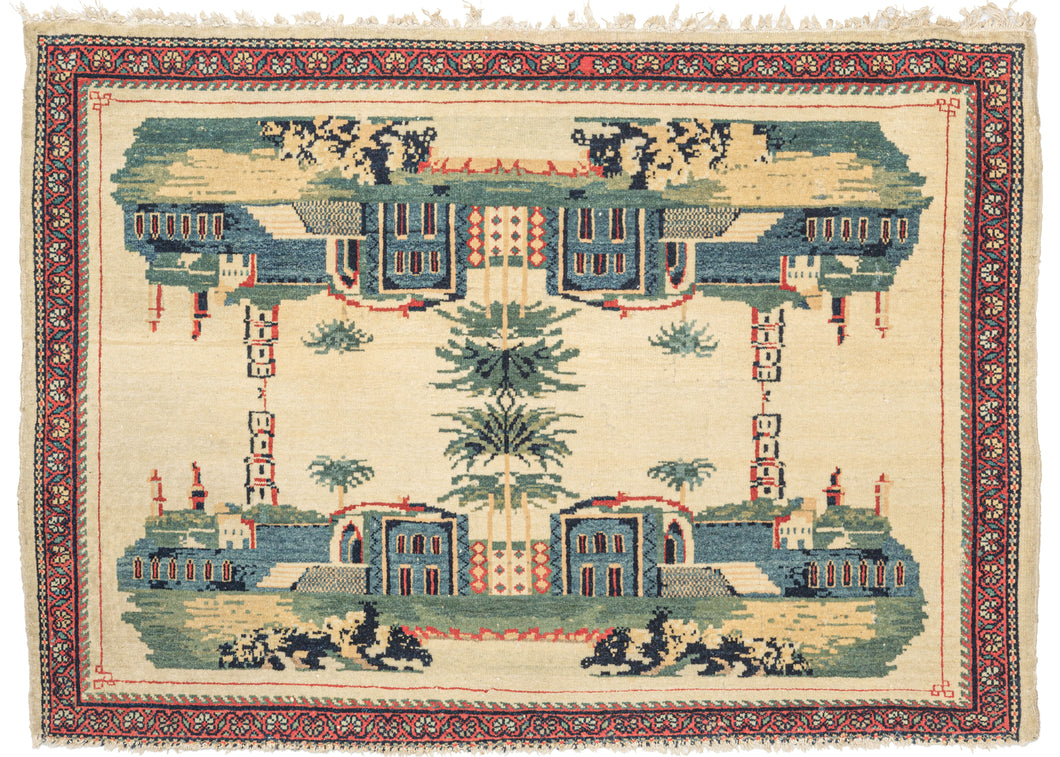 Antique Kashan pictorial rug featuring a scene of the architectural and natural beauty found in the city of Kashan that has been flipped over and reflected in perfect quadrilateral symmetry. It may be depicting Fin Garden - the oldest surviving garden.  Illustrated with calming blues, greens, and yellows with red outlining on a cream ground.  Fun and unexpected, the rendering has a fantastical feel mirage-like feel. 