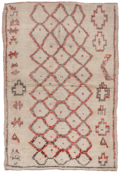 This Beni Ourain rug was woven during the late 20th century in the Middle Atlas Mountains of Morocco.  It features a central column of abstracted diamonds that is flanked by simple protection symbols on either side. Fun and funky in faded reds and blacks on a cream ground.