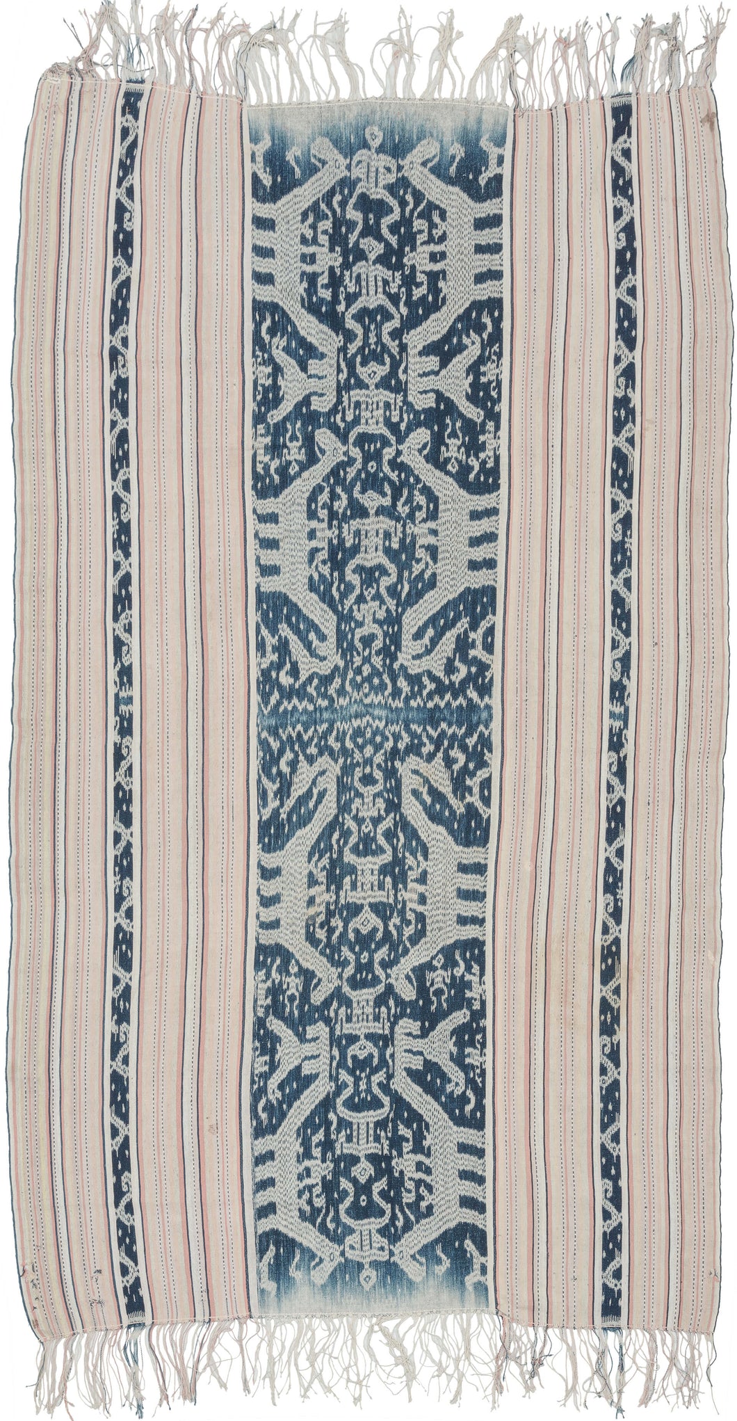 This ikat was handmade on the island of Sumba in Indonesia during the middle of the 20th century.  Ikat is a warp resist dyeing technique similar to 