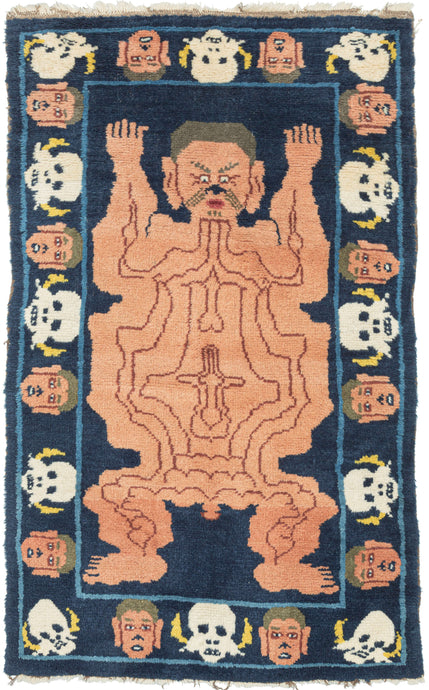 Tantric meditation mat in Tibet.  It features a man's body which is flayed open with various lines representing different layers of the internal nervous system. It is an expression of the Buddhist pursuit of bodily detachment. Practitioners of Tibetan Vajrayana Buddhism in pursuit of spiritual enlightenment, used in meditation or as a seat of power or authority by advanced practitioners of esoteric Buddhism. The outer border alternates between a head and skull representing the transitoriness of life. 