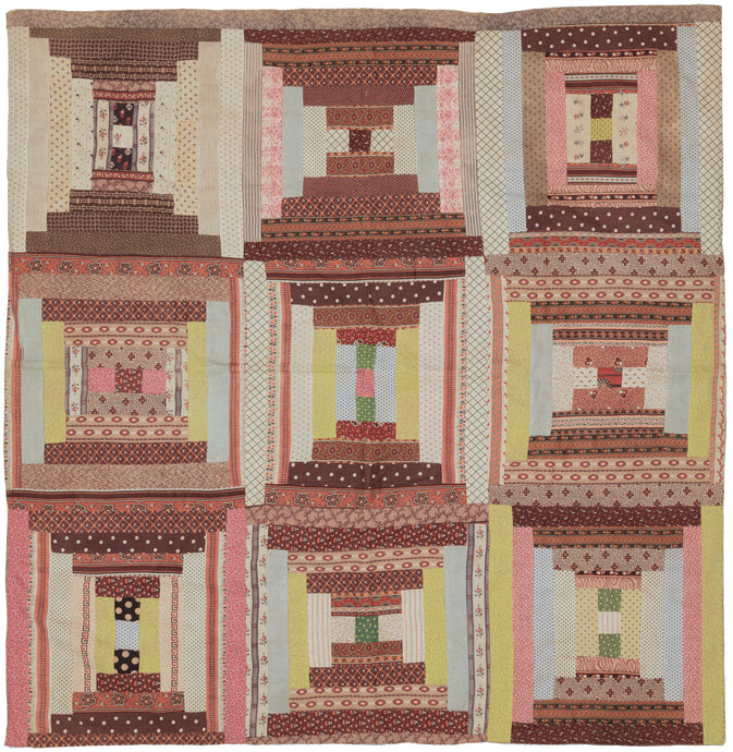 This quilt was hand-sewn in North America during the early 20th century.   It features a variation of the log cabin pattern in various hourglass shapes. The nine squares are composed of pieced-together patterned fabrics and backed with wonderful patterned fabric.  In very good condi